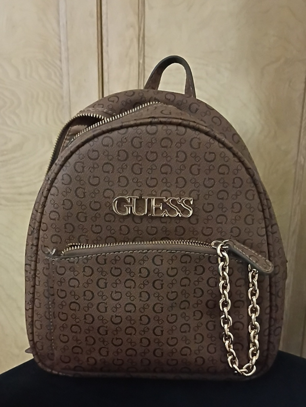 GUESS Brown Monogram Mini Backpack with Gold Chain Accent